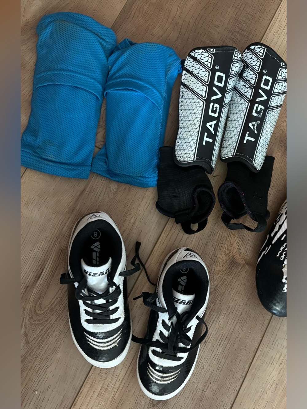 Toddler soccer shinguards (2 pair) and 1pair of cleats